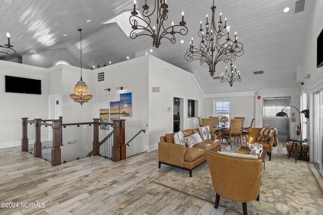 living room with light wood-type flooring, high vaulted ceiling, a chandelier, and crown molding