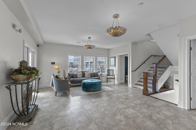 living room with a notable chandelier