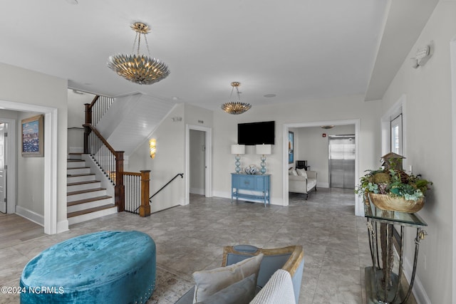 living room with a notable chandelier