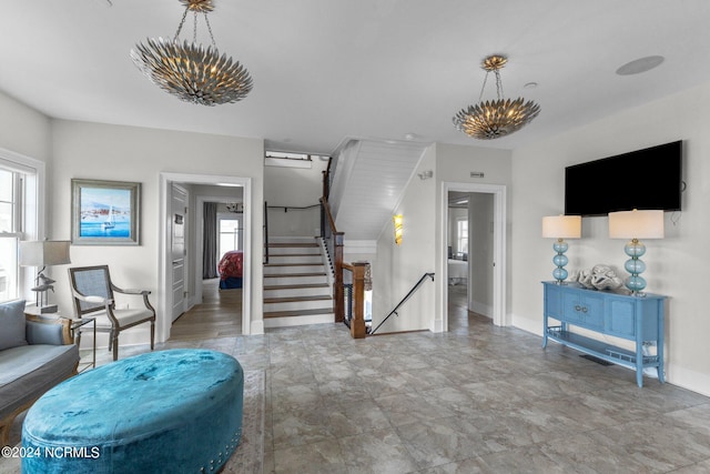 living room with a notable chandelier