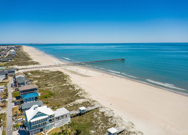 birds eye view of property with a view of the beach and a water view