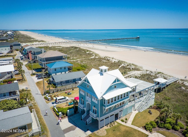 bird's eye view featuring a beach view and a water view