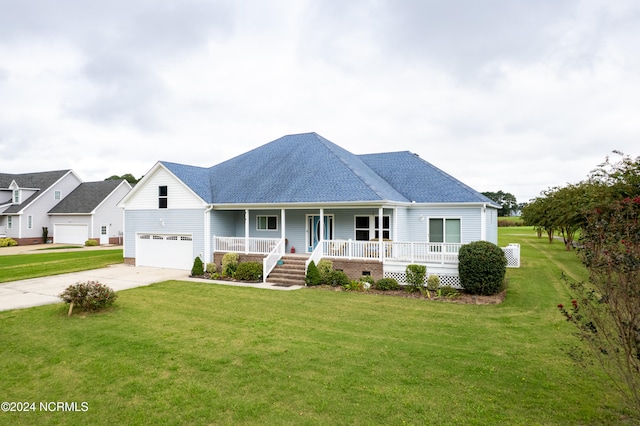 view of front facade featuring a garage, a front lawn, and a porch