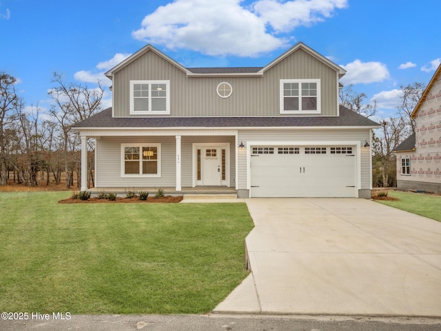 view of front of home with a garage, a front yard, and a porch