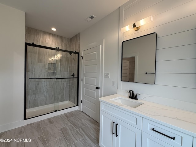 bathroom featuring vanity and walk in shower