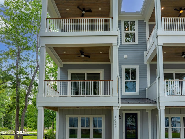 exterior space with a balcony and ceiling fan