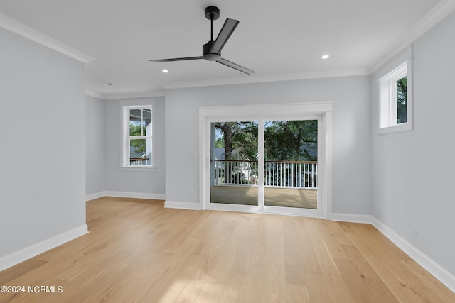 interior space featuring ceiling fan, a healthy amount of sunlight, and ornamental molding