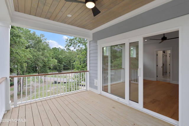 wooden deck featuring ceiling fan