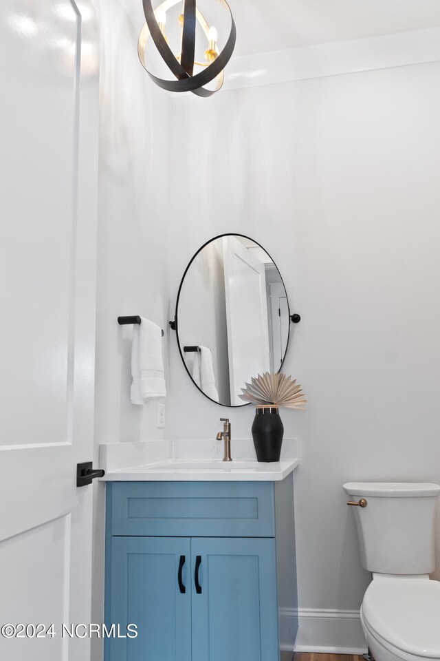 bathroom featuring toilet and vanity