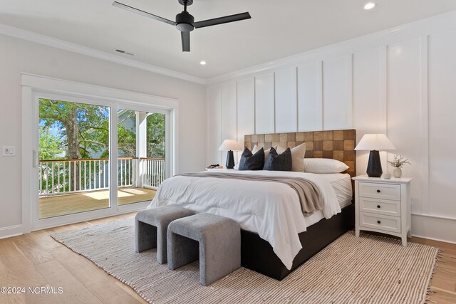 bedroom featuring access to outside, light hardwood / wood-style floors, crown molding, and ceiling fan