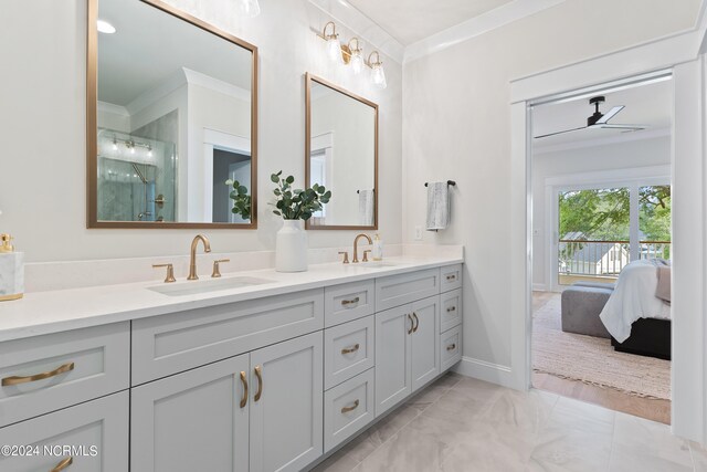 bathroom with ceiling fan, double sink, tile floors, ornamental molding, and large vanity