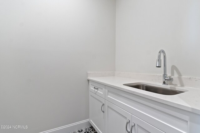 bathroom featuring tile floors and sink