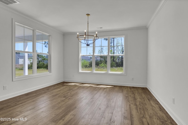 unfurnished dining area featuring visible vents, baseboards, a notable chandelier, ornamental molding, and dark wood-type flooring