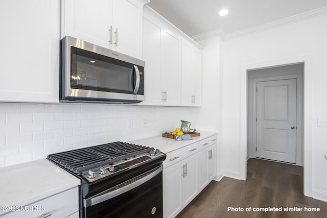 kitchen featuring dark wood-type flooring, a fireplace, dishwasher, and a sink