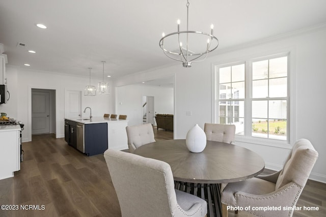 hallway with a notable chandelier, baseboards, wood finished floors, and recessed lighting