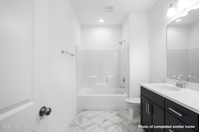 bathroom featuring double vanity, baseboards, toilet, and a sink