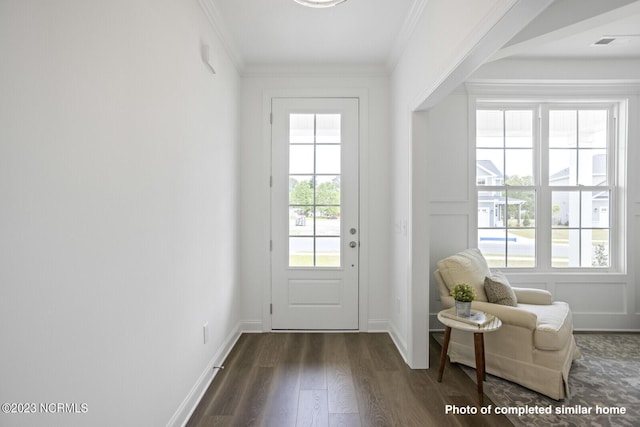 corridor with dark wood-style floors, ornamental molding, and recessed lighting