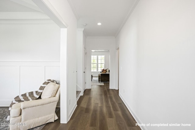 living area featuring beam ceiling, visible vents, a decorative wall, wood finished floors, and coffered ceiling