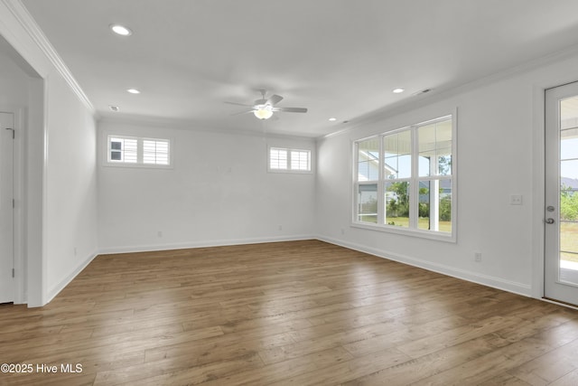 unfurnished room with a ceiling fan, baseboards, ornamental molding, recessed lighting, and hardwood / wood-style floors