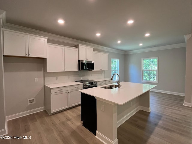 1114 Natal Dr SE, Bolivia, NC 28422 - kitchen featuring stainless steel appliances, a sink, crown molding, a kitchen island with sink, and tasteful backsplash