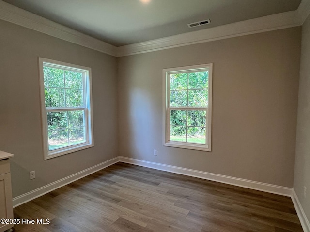 1114 Natal Dr SE, Bolivia, NC 28422 - spare room featuring crown molding, dark wood-style floors, and baseboards