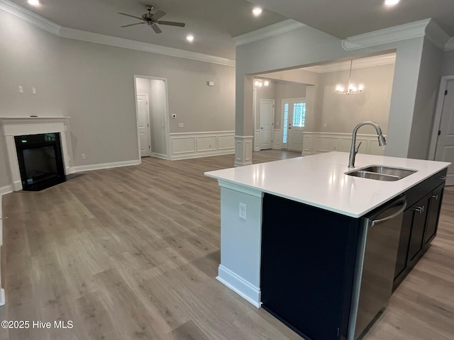 1114 Natal Dr SE, Bolivia, NC 28422 - kitchen with a sink, crown molding, light countertops, ceiling fan, and a center island with sink