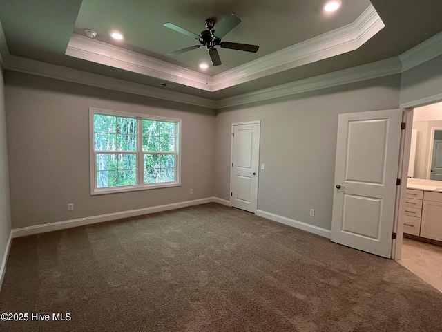 1114 Natal Dr SE, Bolivia, NC 28422 - unfurnished bedroom with ornamental molding, a tray ceiling, carpet, baseboards, and ensuite bath