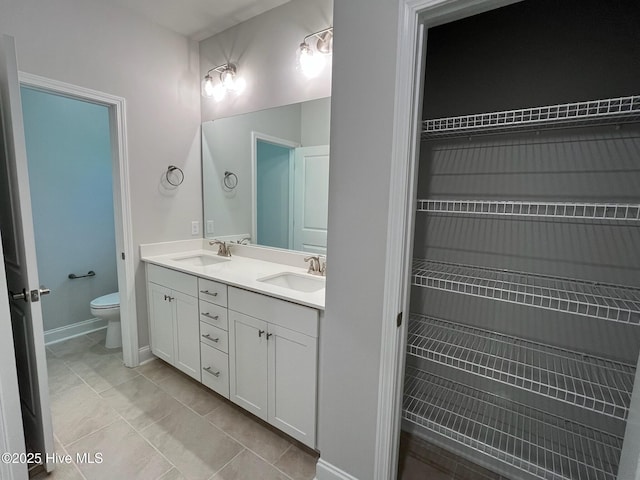 1114 Natal Dr SE, Bolivia, NC 28422 - full bath featuring double vanity, toilet, and baseboards