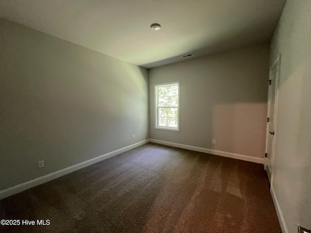 1114 Natal Dr SE, Bolivia, NC 28422 - spare room with baseboards and dark carpet