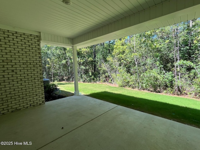 1114 Natal Dr SE, Bolivia, NC 28422 - view of patio / terrace with a wooded view