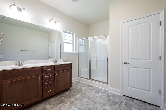 bathroom featuring walk in shower and vanity