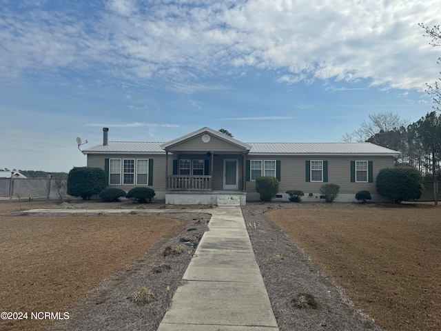 single story home featuring a porch