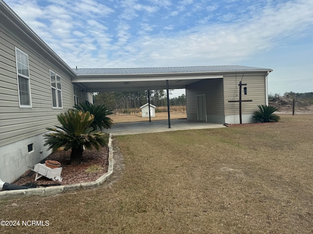 exterior space with a carport and an outdoor structure