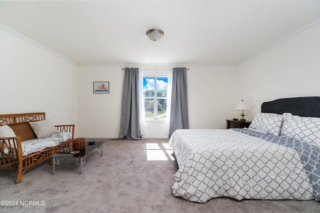 bedroom with carpet floors and crown molding