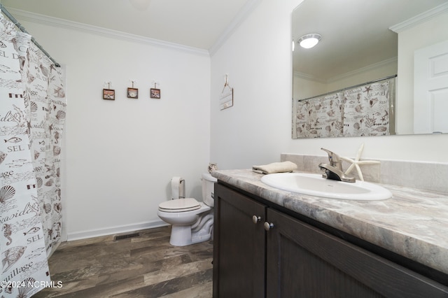 bathroom featuring wood-type flooring, toilet, vanity, and ornamental molding