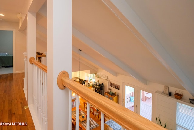 details featuring an inviting chandelier, dark wood-type flooring, and beamed ceiling