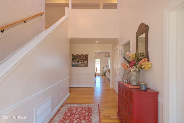 foyer with light hardwood / wood-style floors