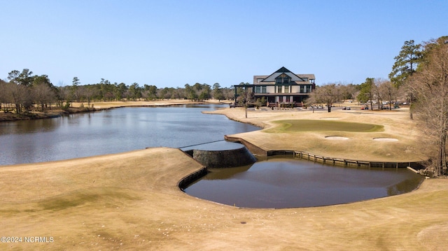 view of community with a water view