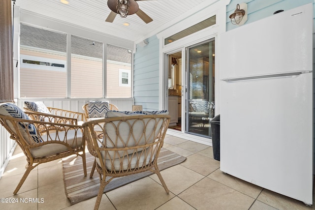 sunroom / solarium with ceiling fan