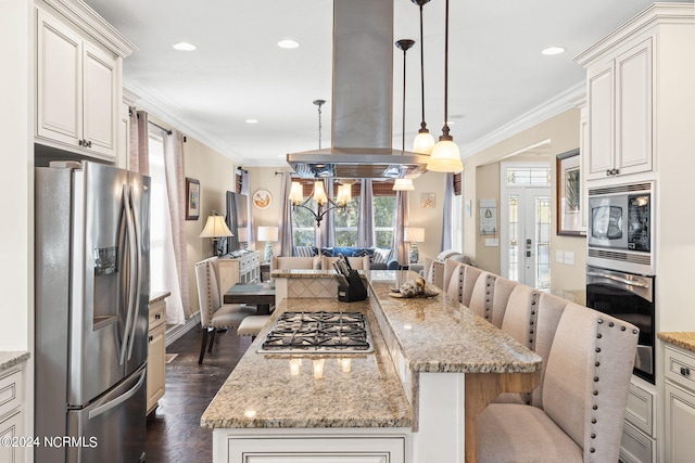 kitchen featuring dark hardwood / wood-style floors, appliances with stainless steel finishes, a breakfast bar, and island range hood