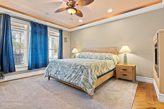 bedroom featuring ceiling fan and crown molding