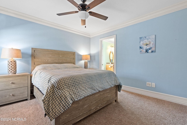 carpeted bedroom featuring ceiling fan, ornamental molding, and ensuite bathroom