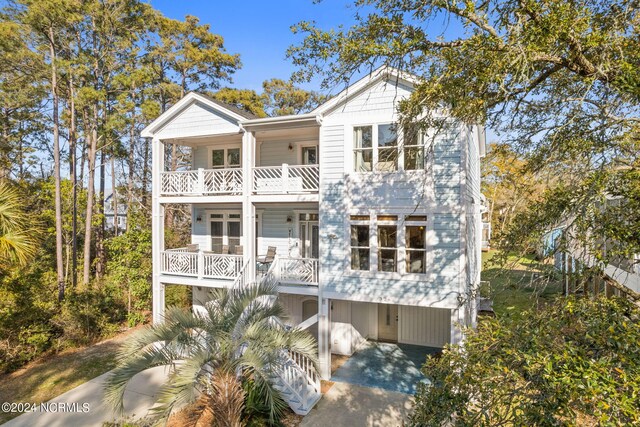 coastal inspired home featuring a balcony