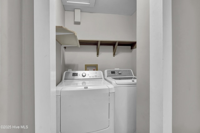 laundry room with laundry area and washing machine and clothes dryer