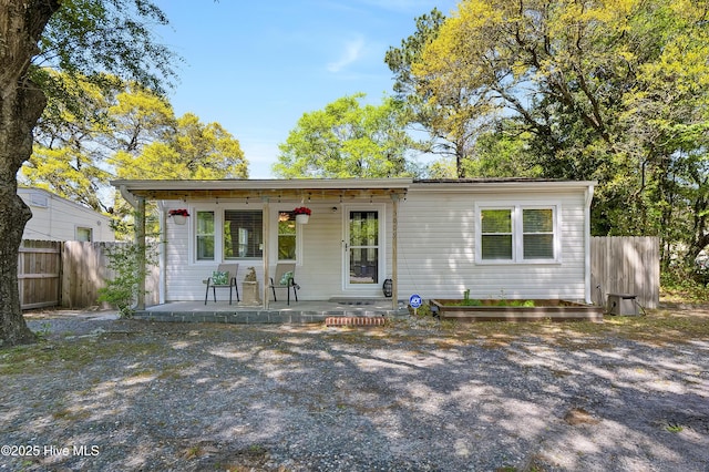 view of front of house featuring fence