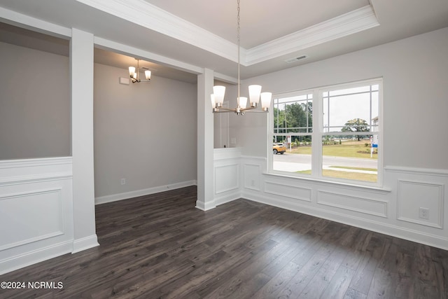 unfurnished dining area featuring a tray ceiling, crown molding, dark hardwood / wood-style floors, and a notable chandelier