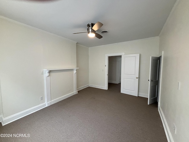 unfurnished bedroom featuring ceiling fan and dark carpet