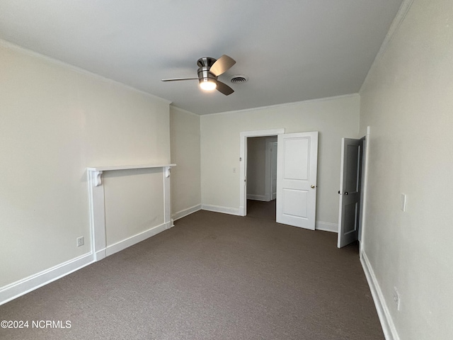 unfurnished bedroom with crown molding, ceiling fan, and dark colored carpet