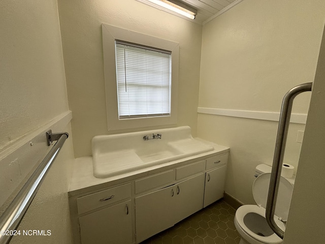 bathroom with vanity, tile flooring, and toilet