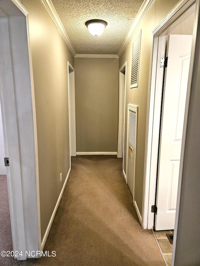 corridor with crown molding and light colored carpet